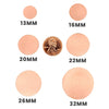 Copper blank round discs in a variety of widths with a penny for scale.