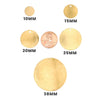 Brass blank round disc pendants with hole in a variety of widths with a penny for scale.