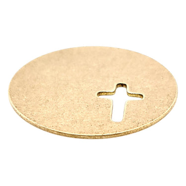 Brass blank round cross cutout pendant at an angle.