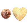 Brass blank holed heart pendant with a penny for scale.