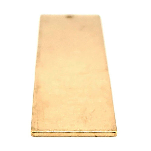 Brass blank vertical rectangle pendant at an angle.
