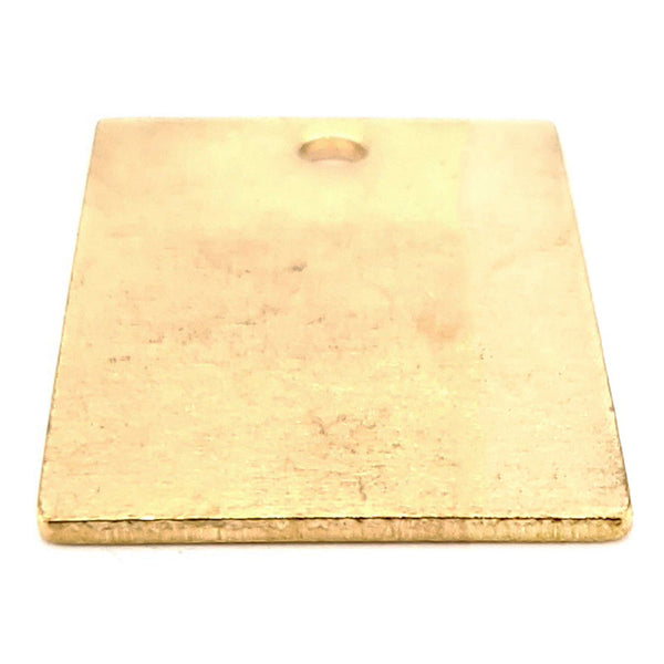 Brass blank vertical rectangle pendant at an angle.
