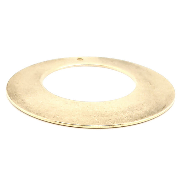 Brass blank holed washer pendant at an angle.