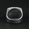 Stainless steel polished "BIKER" men's ring back view on a black leather background.
