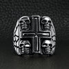 Stainless steel polished multi skull Cross ring on a black leather background.