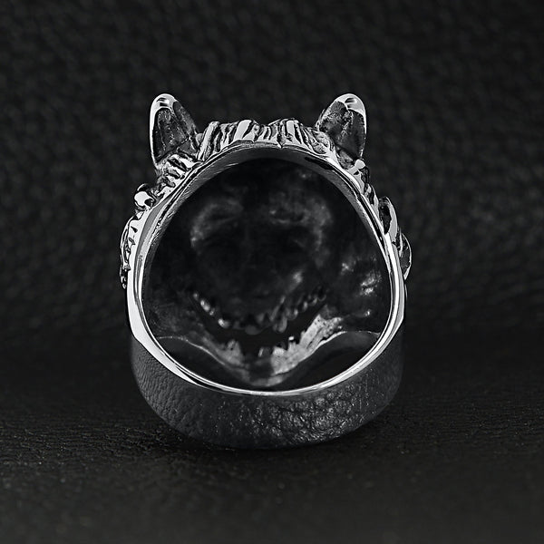 Stainless steel polished snarling wolf ring back view on a black leather background.