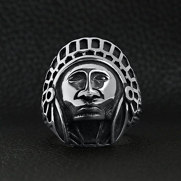 Stainless steel Native American Chief ring on a black leather background.