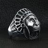 Stainless steel Native American Chief ring angled on a black leather background.