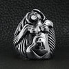 Stainless steel nude woman Goddess ring on a black leather background.