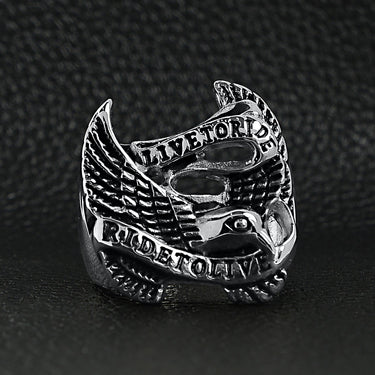 Stainless steel "Live To Ride" "Ride To Live" eagle biker ring on a black leather background.