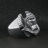 Stainless steel "Live To Ride" "Ride To Live" eagle biker ring angled on a black leather background.