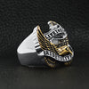 Stainless steel 18K gold PVD Coated "Live To Ride" "Ride To Live" eagle biker ring angled on a black leather background.