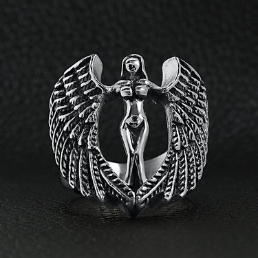 Stainless steel large nude angel ring on a black leather background.