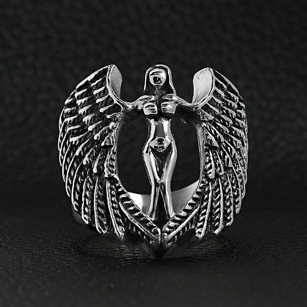 Stainless steel large nude angel ring on a black leather background.