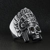 Stainless steel black Cubic Zirconia eyed Native American chief skull ring angled on a black leather background.