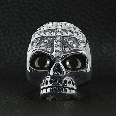 Stainless steel black Cubic Zirconia eyed skull with clear Cubic Zirconia UK flag ring on a black leather background.