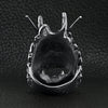 Stainless steel eastern luck dragon head ring back view on a black leather background.