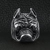 Stainless steel pit bull dog ring on a black leather background.
