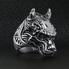 Stainless steel eastern lucky dragon head ring angled on a black leather background.