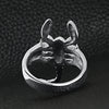 Stainless steel scorpion ring back view on a black leather background.