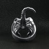 Stainless steel scorpion men's ring back view on a black leather background.