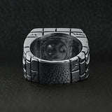Stainless steel medieval jailed skull with 18K gold PVD Coated Cross accents ring back view on a black leather background.