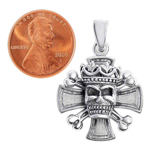 Sterling silver cross with king skull and crossbones pendant with a penny for scale.