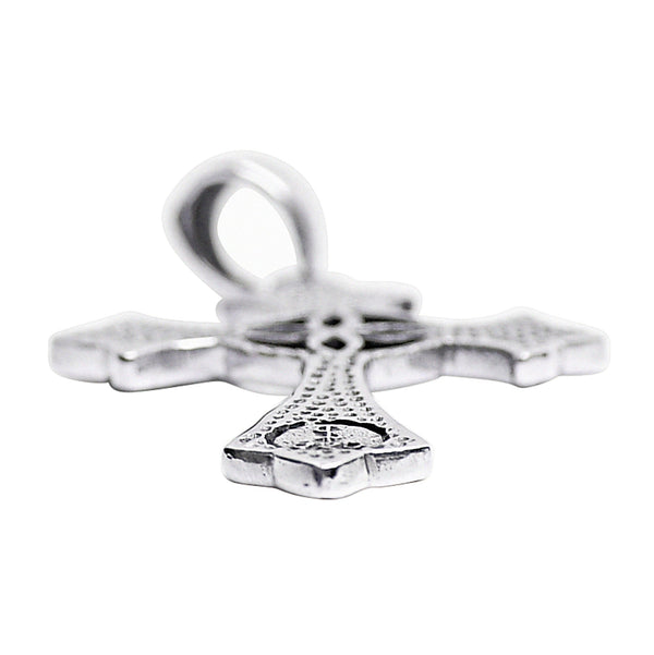 Sterling silver Celtic cross pendant at an angle.