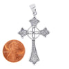 Sterling silver Celtic cross pendant with a penny for scale.