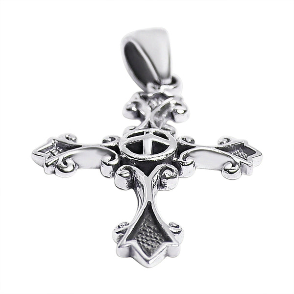 Sterling silver detailed cross pendant at an angle.