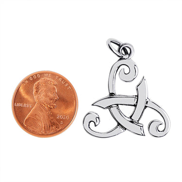 Sterling silver Viking Odin's horn Celtic pendant with a penny for scale.