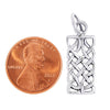 Sterling silver Celtic knot rectangle pendant with a penny for scale.