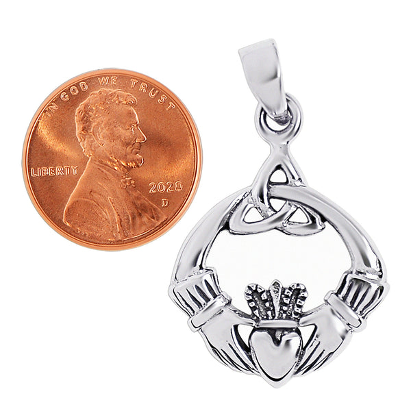 Sterling silver Celtic knot Claddagh pendant with a penny for scale.