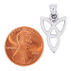 Sterling silver upside down Celtic trinity knot pendant with a penny for scale.