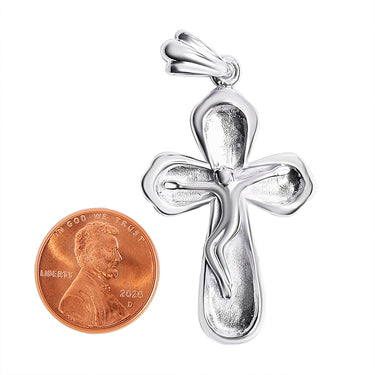 Sterling silver Crucifix Cross pendant with a penny for scale.