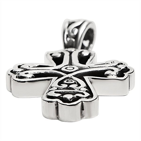 Sterling silver filigree Cross pendant at an angle.