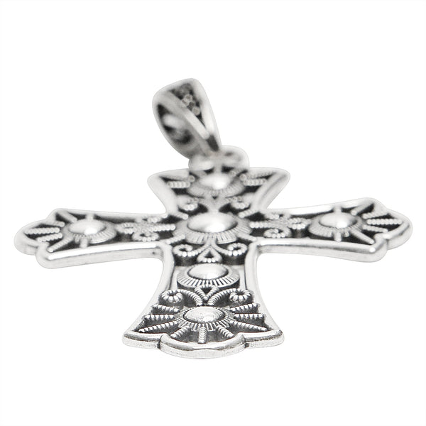 Sterling silver detailed Cross pendant at an angle.