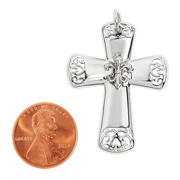 Sterling silver filigree Fleur de Lis Cross pendant with a penny for scale.