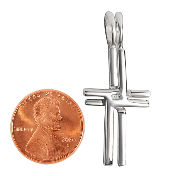 Sterling silver double Cross pendant with a penny for scale.