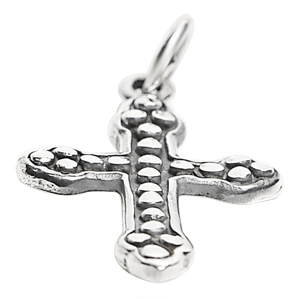 Sterling silver studded Cross pendant at an angle.