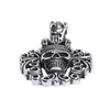 Sterling silver filigree king skull pendant at an angle.