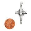 Sterling silver Crucifix Cross pendant with a penny for scale.