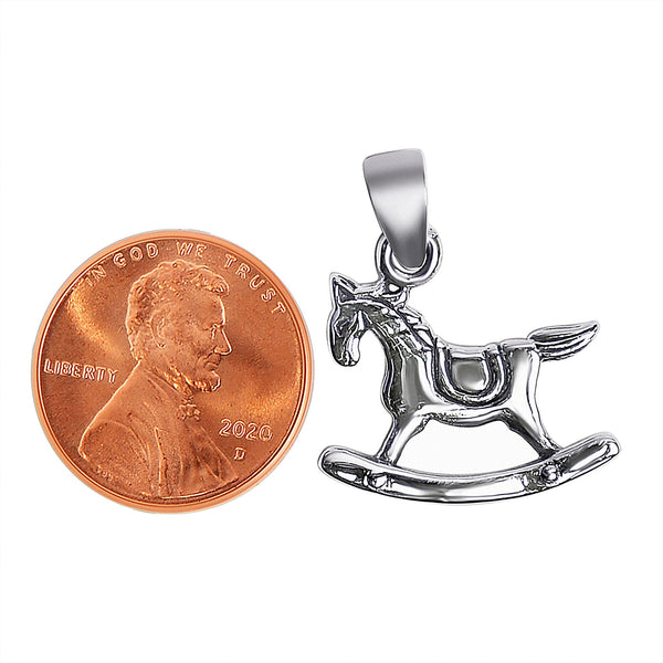 Sterling silver rocking horse pendant with a penny for scale.