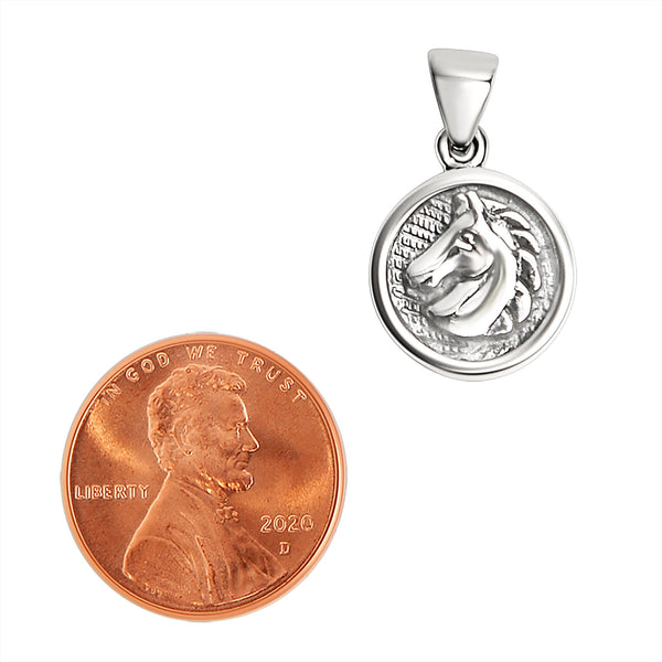 Sterling silver horse pendant with a penny for scale.