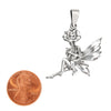 Sterling silver fairy and flower pendant with a penny for scale.