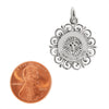 Sterling silver "Confirmation" Cross pendant with a penny for scale.