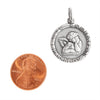 Sterling Silver "Our Angel Protect Us" angel pendant with a penny for scale.