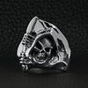 Sterling silver grim reaper skull with scythe ring on a black leather background.