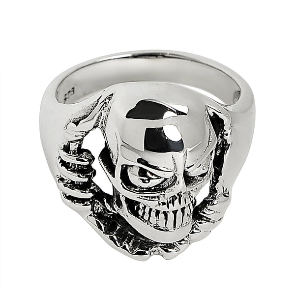 Sterling silver skull tearing through ring angled down.