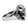 Sterling silver skull tearing through ring side view.